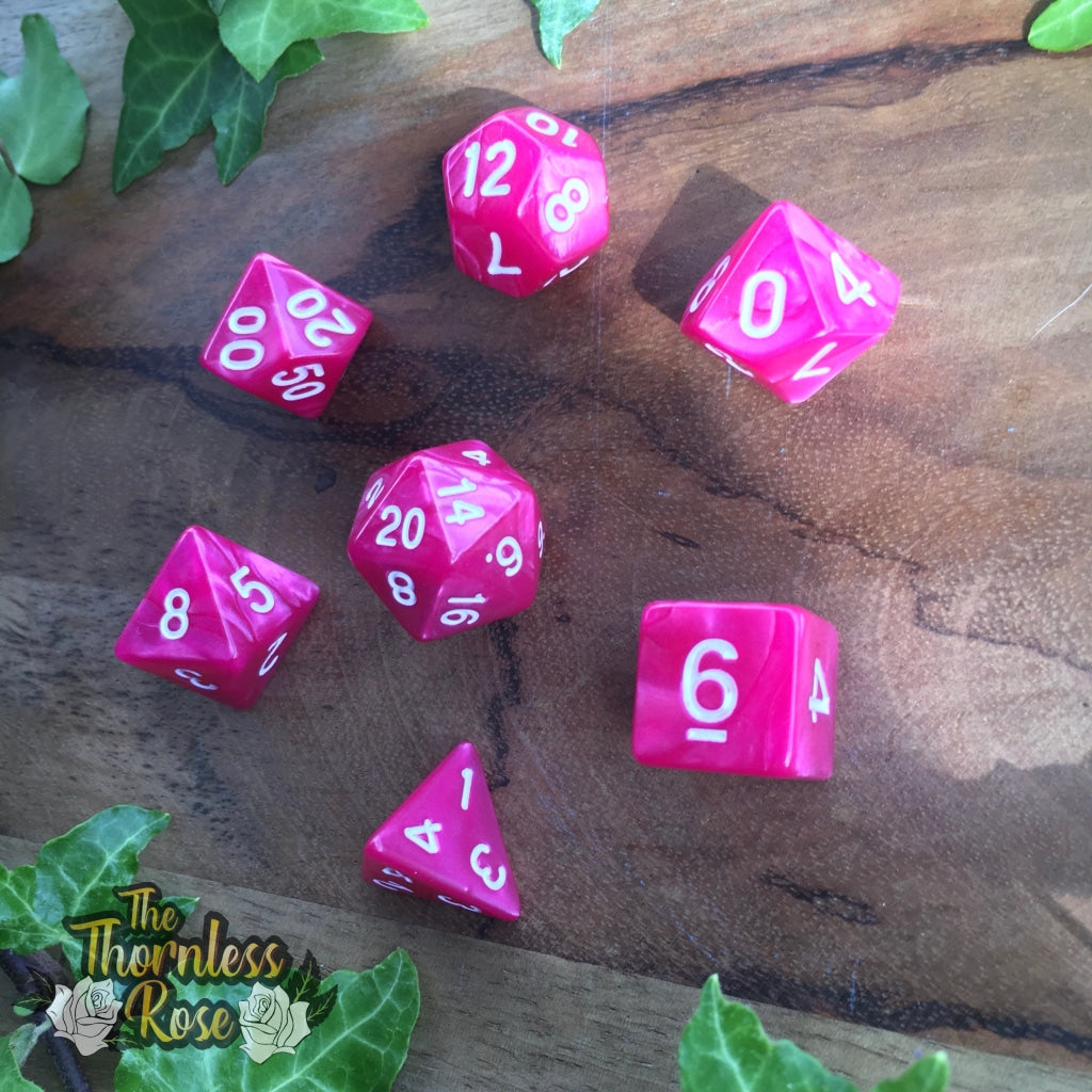 a bunch of pink and white signs on the ground