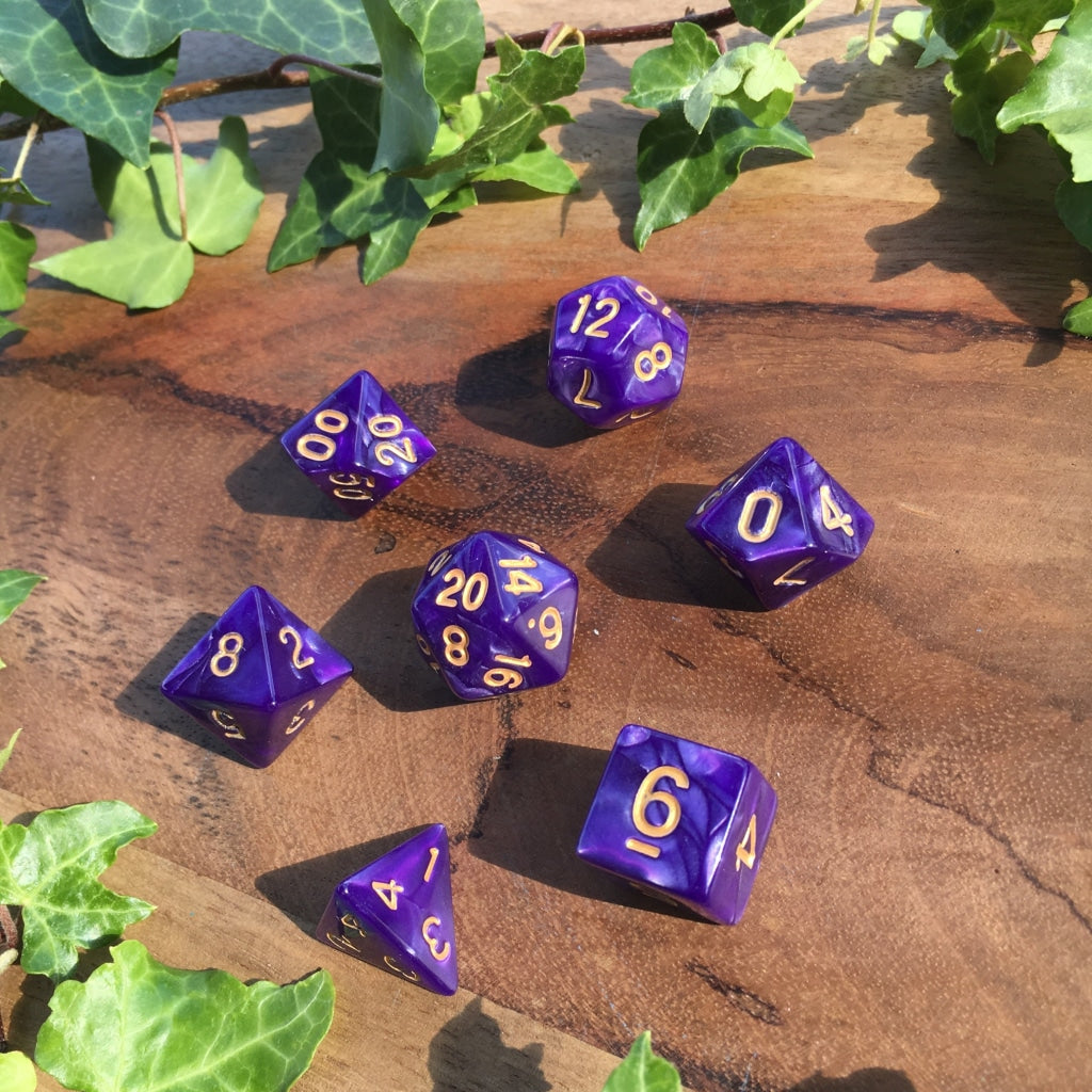 a row of blue and purple umbrellas sitting on the ground