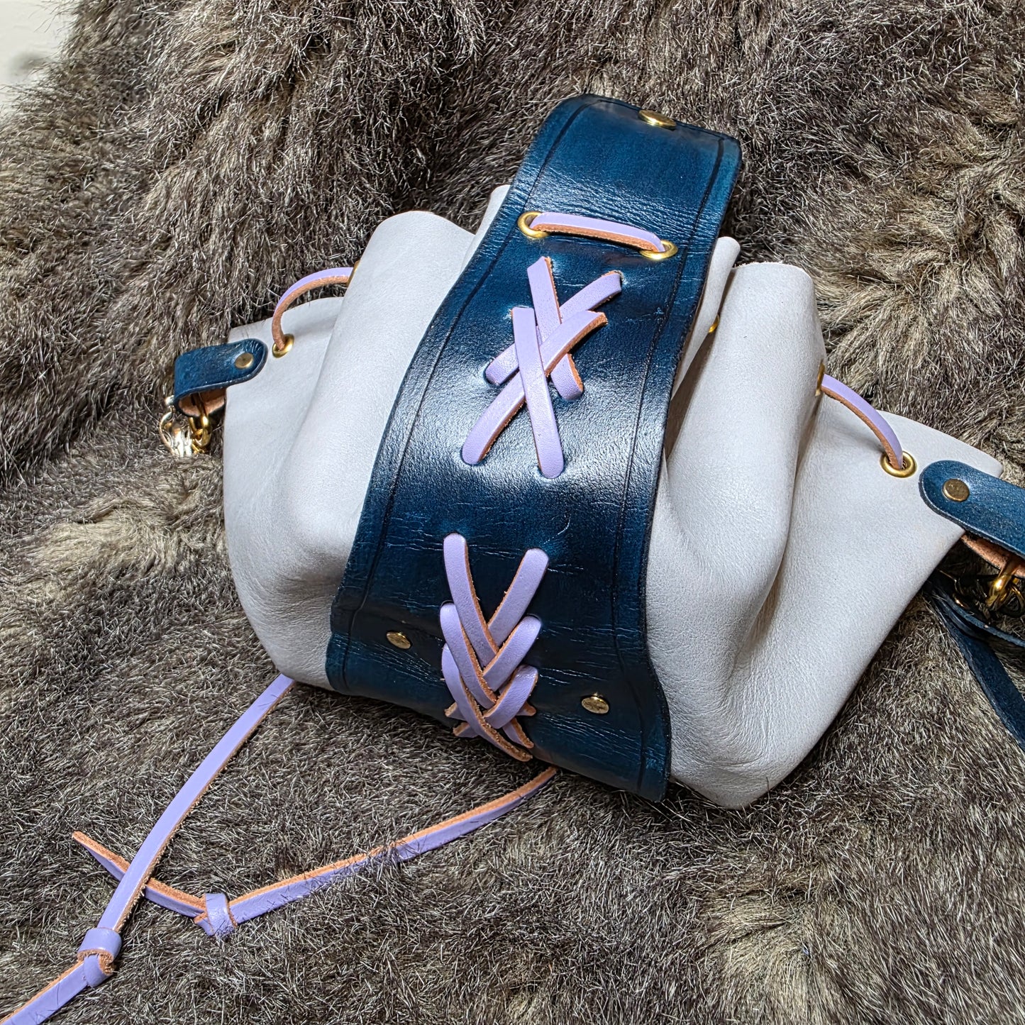 Dark Blue and Grey Leather Drawstring Bag with Sword Charm