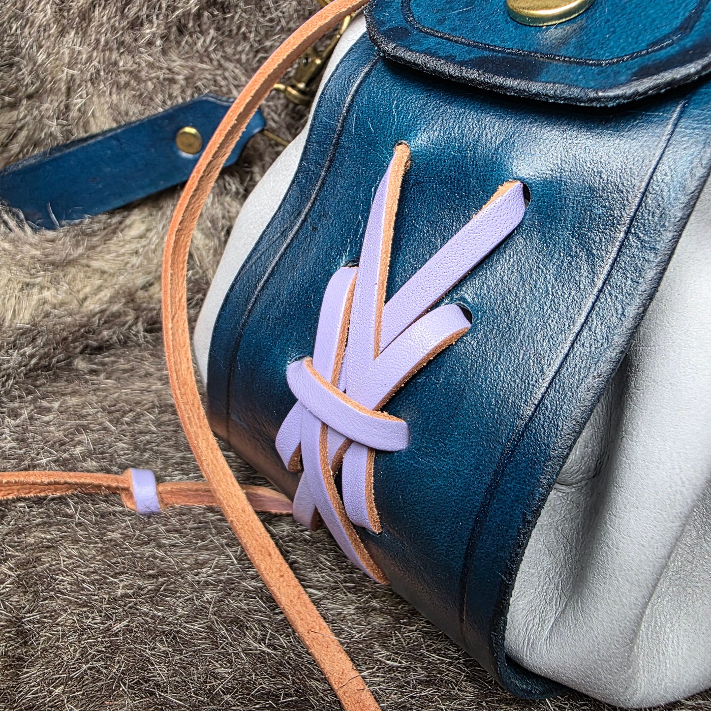 Dark Blue and Grey Leather Drawstring Bag with Sword Charm