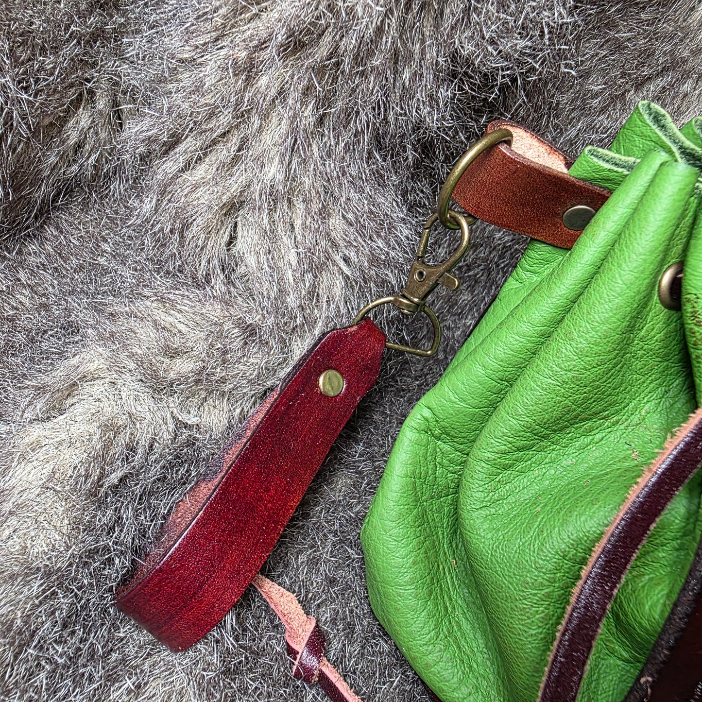 Brown and Bright Green Leather Drawstring Bag with Sickle and Leaf Charm