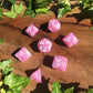 a bunch of pink flowers are in a box 