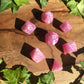 a bunch of pink flowers are in a box 